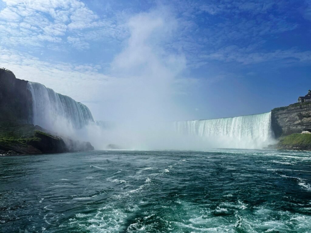 A large waterfall in the middle of a body of water